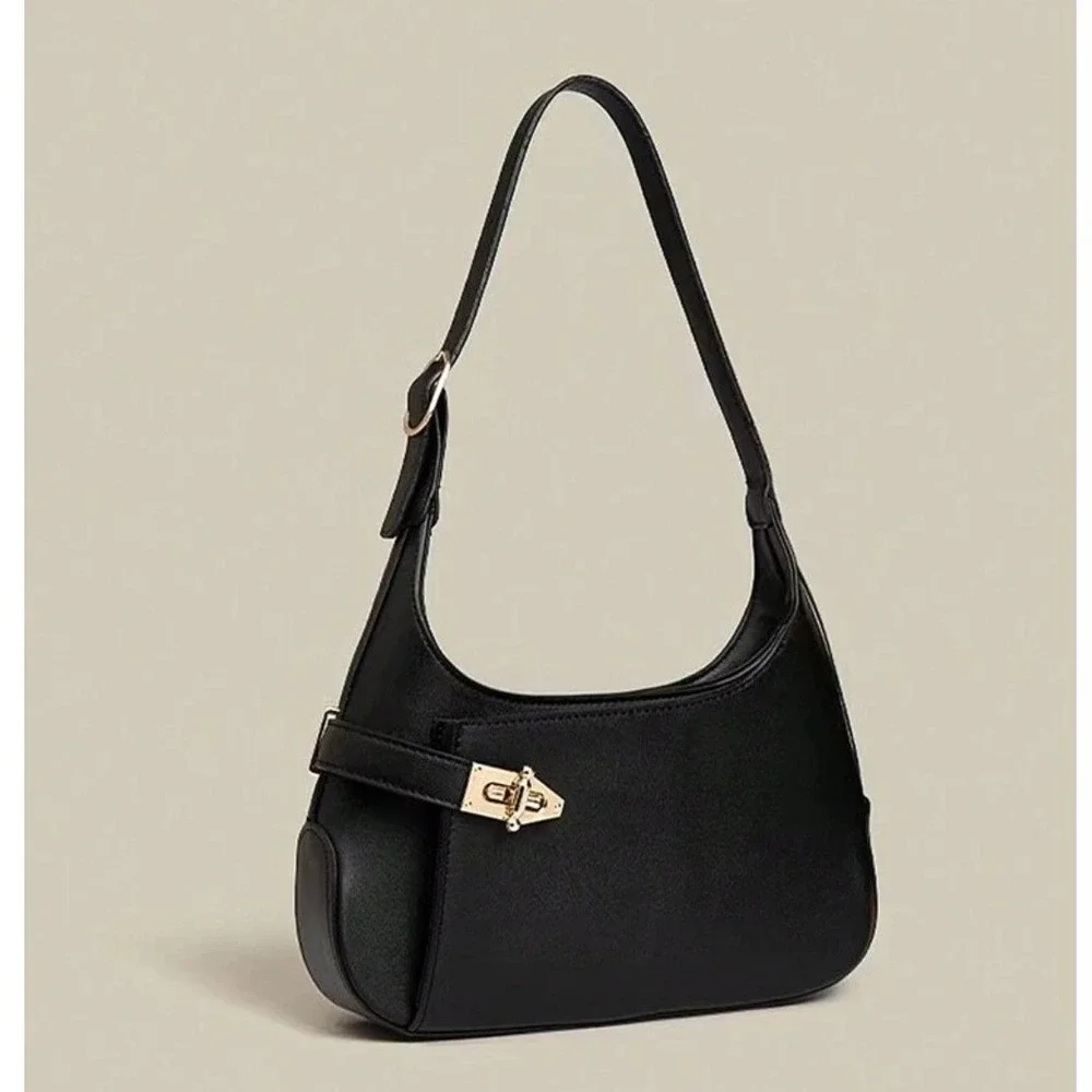 Minimalist black hobo shoulder bag gold hardware under arm‎